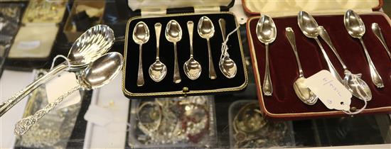 Two sets of 6 silver spoons (cased), pair of serving spoons and another